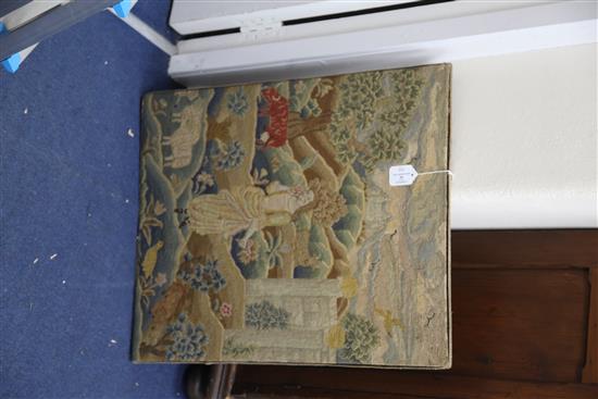 An 18th century needlework panel depicting a shepherdess in a landscape, 26.5 x 22in.